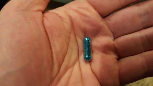 blue glitter poop pill